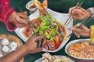 A photo of hands reaching into a shared family dinner with chopsticks