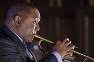 A high resolution, side-view closeup of Wynton Marsalis playing the trumpet