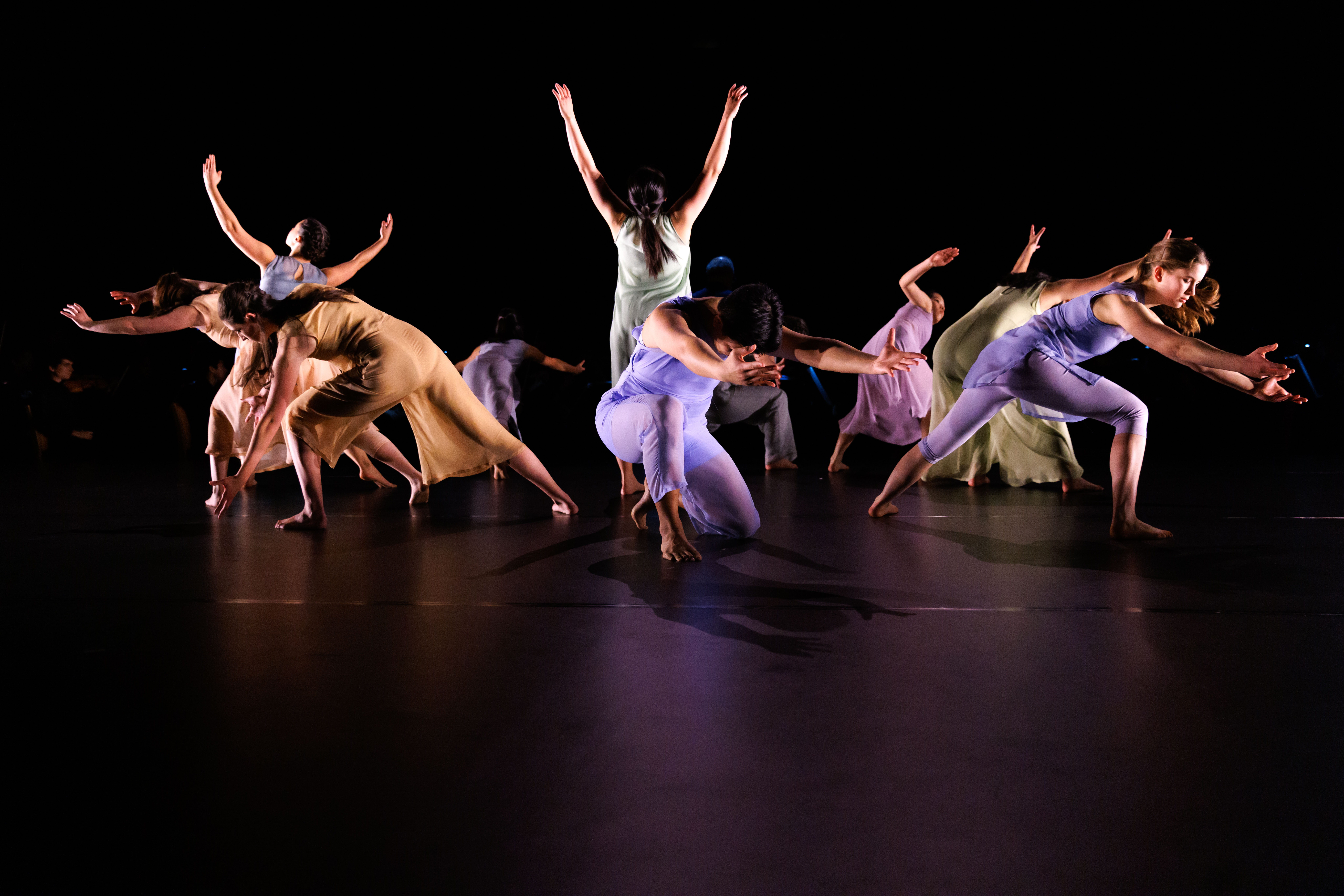 Active dancers in pastel colors.