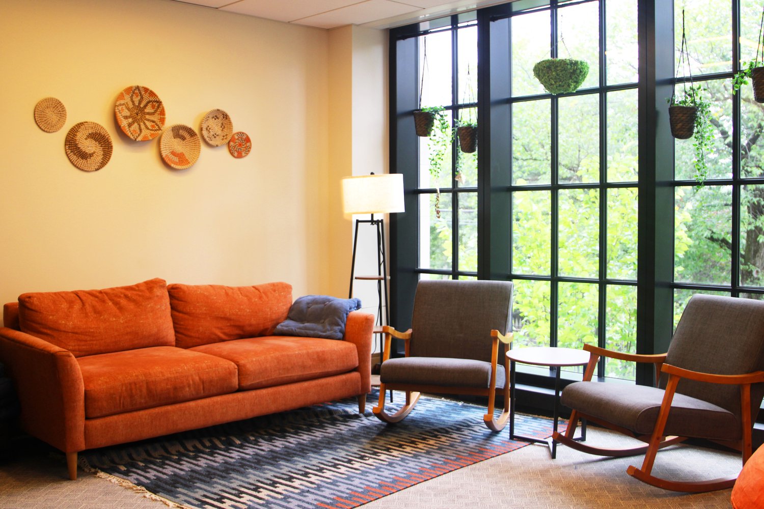 Couch next to window. Natural light and fun decor.