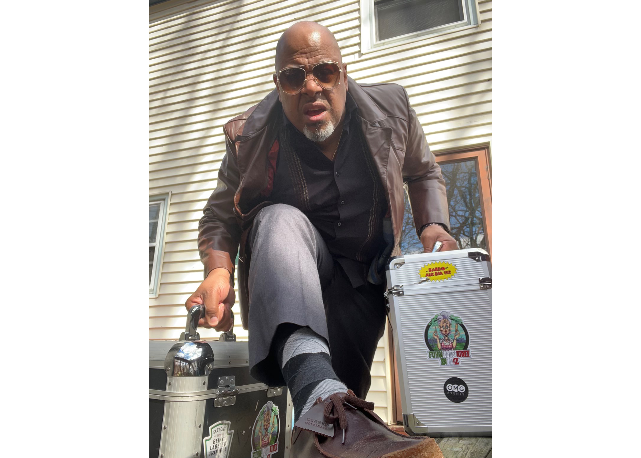 DJ with record cases.