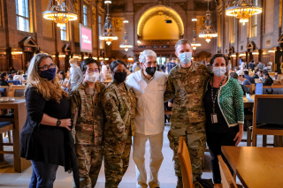 President Salovey is pictured with ROTC students standing in Yale Commons at lunchtime