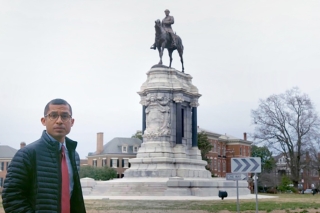 CJ Hunt standing near statue of Robert E. Lee in New Orleans, LA