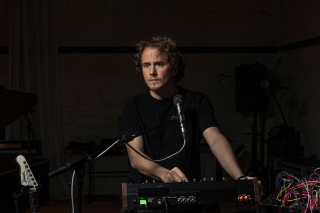 David Chalmin using electronic music equipment