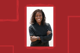 Headshot, smiling with arms crossed.