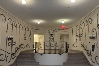 The classical layout of The Dome with art installation in black on white walls.