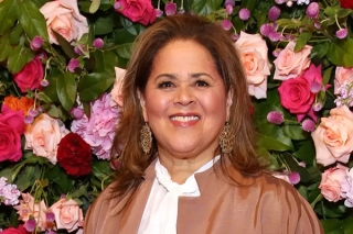 Anna Deavere Smith in front of roses. 