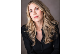 Portrait photography of a woman with blonde hair wearing a black shirt