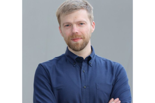Portrait photography of a man in a navy blue button down