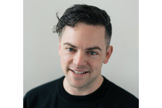 Portrait photo of a man in a black shirt