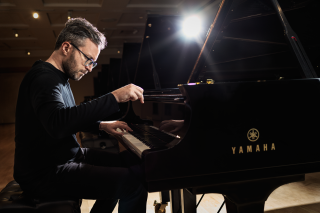 Conor Hanick performing on a Yamaha grand piano