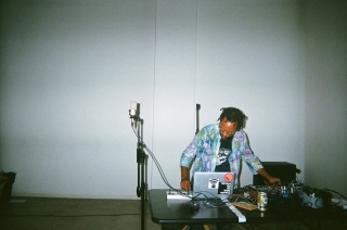 Devin Kenny working as a DJ