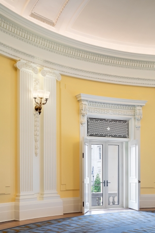  A close-up of the yellow walls and a set of double doors in the Presidents' Room.