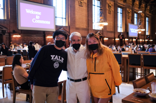 Yale President Peter Salovey poses with a group of students at lunch in Commons