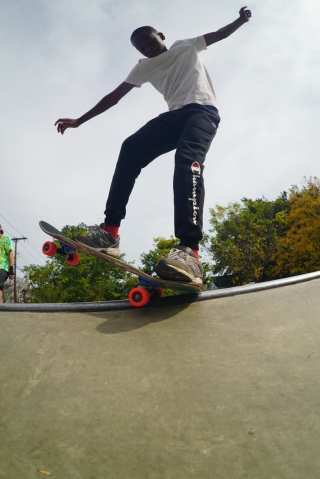 A young skateboarder demonstrates his skills