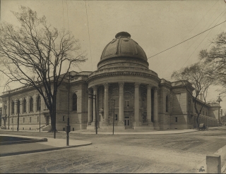 An old, black and white photo of the exterior of the rotunda.