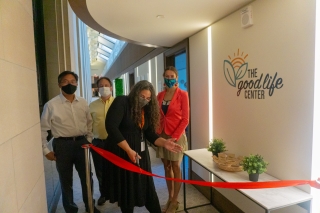The team behind The Good Life Center cut the ceremonial ribbon.