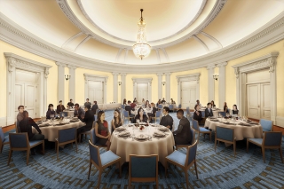 People dining at tables in the brightly lit Presidents' Room.