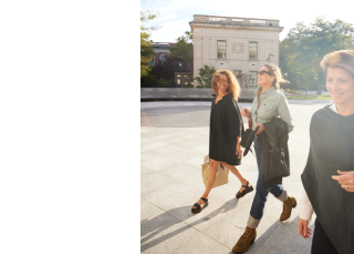 Rebecca Miller 84' with Yale Schwarzman Center Executive Director Rachel Fine and Associate Artistic Director Jennifer Harrison Newman MFA '11, walking outdoors in Humanities Quadrangle