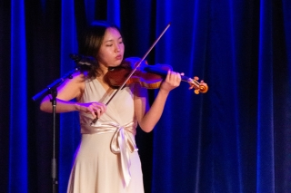 Woman playing a violin. 