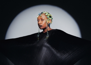 Cécile McLorin Salvant in wide black gown