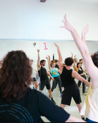 People enjoying a dance class.