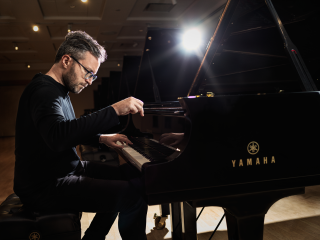 Conor Hanick performing on a Yamaha grand piano