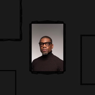 Headshot in black frame.